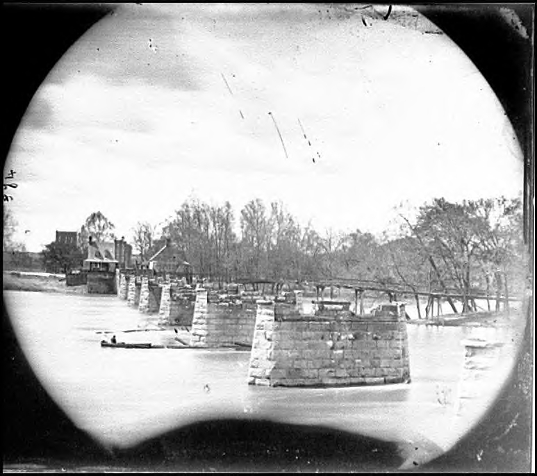 Remains of the Mayo Bridge, over the James River, in Richmond. Though it was not a railroad bridge, the photograph clearly shows the use of stone piers to construct river bridges.